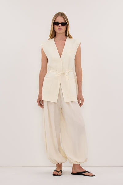Zoe wearing EMORY CREAM COLLARLESS PEPLUM VEST