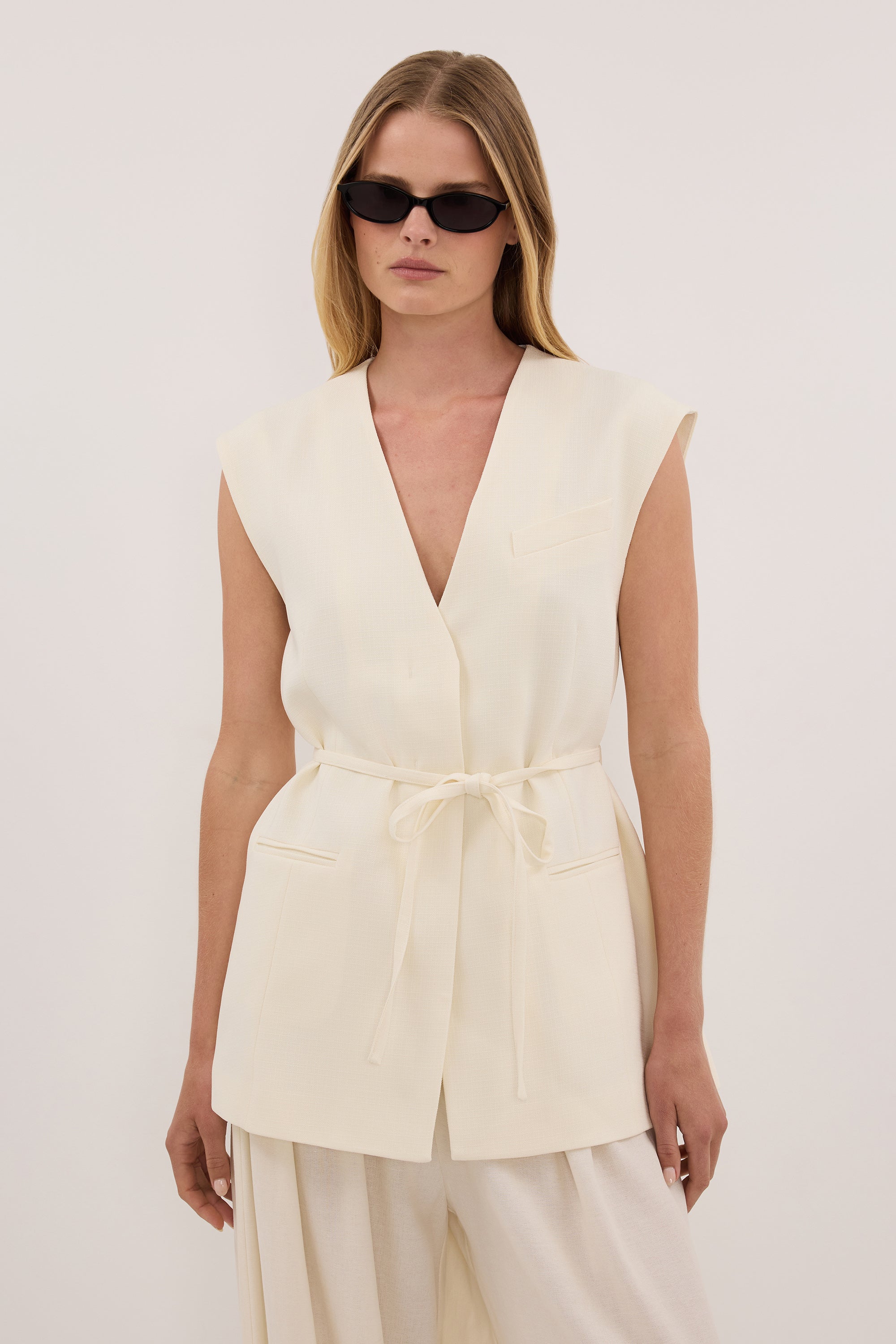 EMORY CREAM COLLARLESS PEPLUM VEST