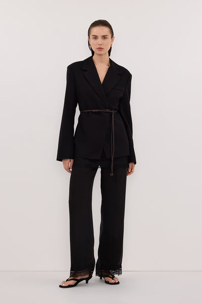 Stas wearing SURI BLACK CINCHED BLAZER