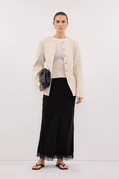 Stas wearing CYRUS BONE COLLARLESS BLAZER