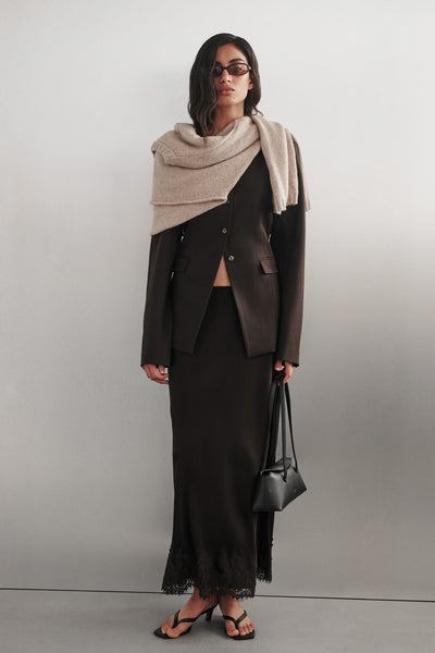 Anaya wearing CYRUS PEAT COLLARLESS BLAZER