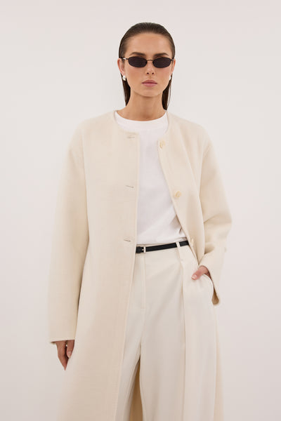 Stas wearing GRETA OFF WHITE COLLARLESS WOOL BLEND COAT