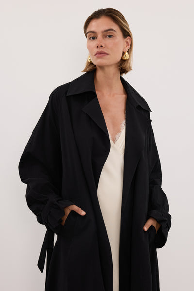 Joanna wearing NINA BLACK LIGHTWEIGHT TRENCH COAT