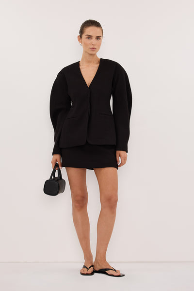 Stas wearing BOBBI BLACK BOUCLE COCOON BLAZER