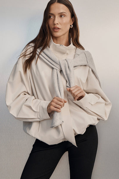 Casey wearing RORY IVORY LIGHTWEIGHT TRACK JACKET