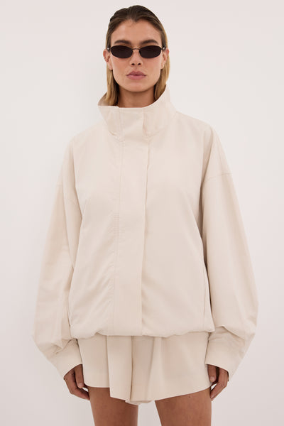 Joanna wearing RORY IVORY LIGHTWEIGHT TRACK JACKET