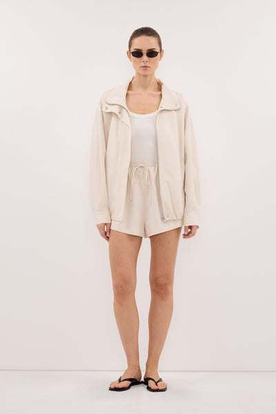Stas wearing RORY IVORY LIGHTWEIGHT TRACK JACKET