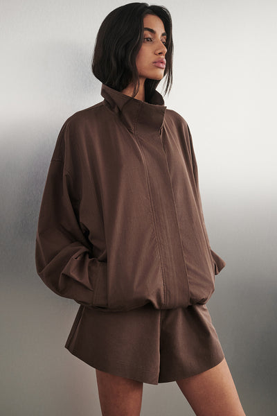 Anaya wearing RORY MILK CHOC LIGHTWEIGHT TRACK JACKET