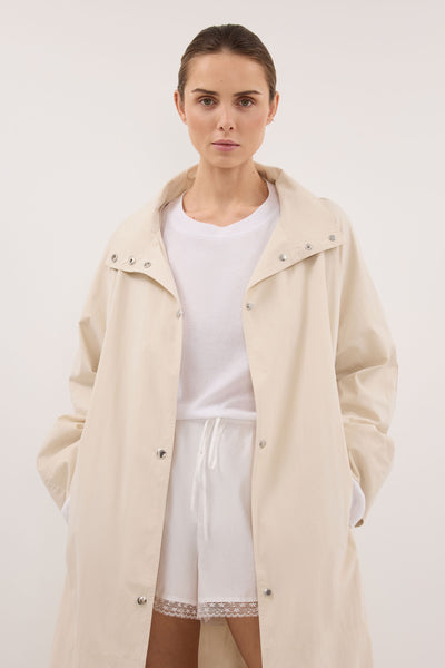 Stas wearing MARIS OYSTER LIGHTWEIGHT TRENCH COAT - PRE ORDER
