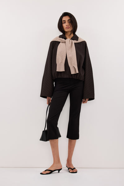 Anaya wearing SIAN PEAT PINSTRIPE BOMBER JACKET