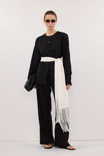 Stas wearing FIORA WHITE CUPRO FRINGE SCARF