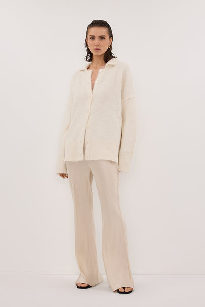 Stas wearing SALMA IVORY POLO NECK KNIT CARDIGAN