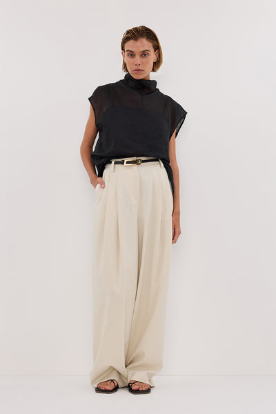 Joanna wearing CARMEL BLACK RAMIE FUNNEL NECK TOP