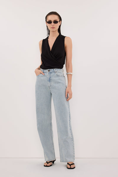 Stas wearing FELICITY BLACK SLEEVELESS WRAP TOP