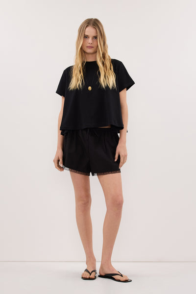 Zoe wearing TATUM BLACK SHORT SLEEVE COTTON TEE