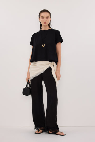 Stas wearing TATUM BLACK SHORT SLEEVE COTTON TEE