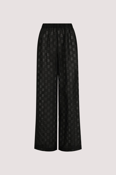 Stas wearing ELBA BLACK SHEER CHECK PANTS