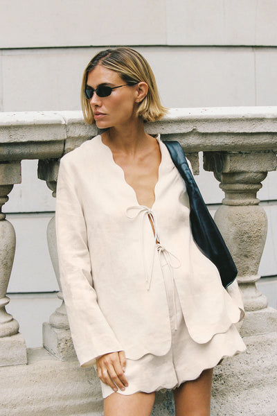 Joanna wearing LELA SANDSTONE LONG SLEEVE LINEN TOP