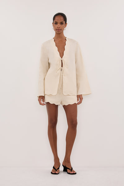 Kristen wearing LELA SANDSTONE LONG SLEEVE LINEN TOP