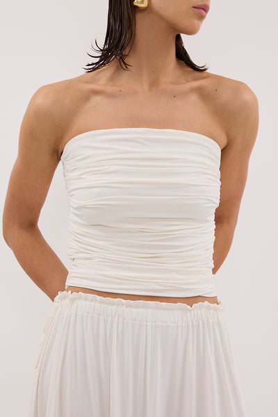 Jasmine wearing SHARI OFF WHITE STRAPLESS BANDEAU TOP