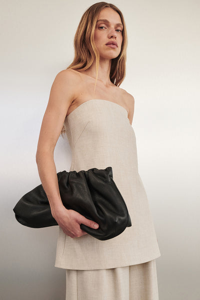 Zoe wearing CYRUS NATURAL STRAPLESS TUNIC TOP
