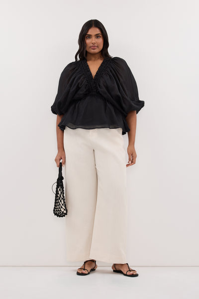 Shanaya wearing BRIELLE BLACK RAMIE LONG SLEEVE TOP