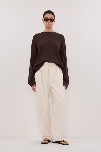 Aude wearing SLOANE CHOC LONG SLEEVE CREW KNIT TOP
