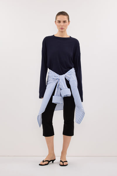 Stas wearing SLOANE NAVY LONG SLEEVE CREW KNIT TOP