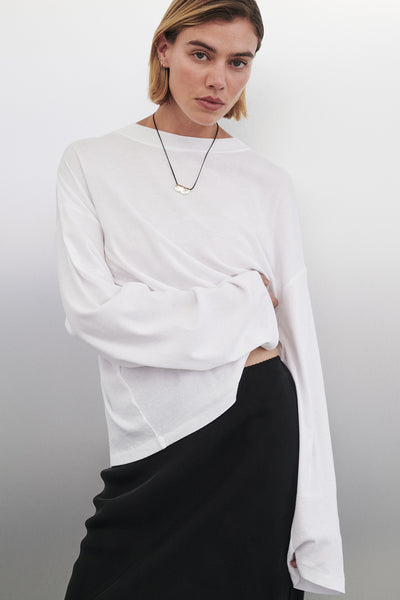 Joanna wearing SLOANE WHITE LONG SLEEVE CREW KNIT TOP