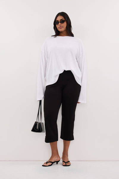 Shanaya wearing SLOANE WHITE LONG SLEEVE CREW KNIT TOP