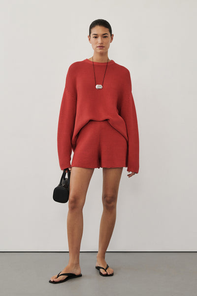Aude wearing THEA BURNT RED COTTON KNIT JUMPER