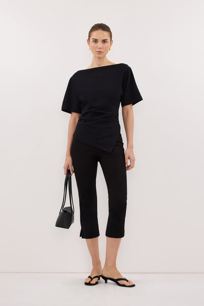 Stas wearing SWANN BLACK ASYM BOAT NECK TEE