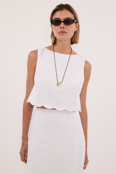 Joanna wearing LELA WHITE LINEN CROP TOP