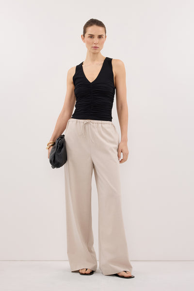 Stas wearing AVELIN BLACK RUCHED V NECK KNIT TOP