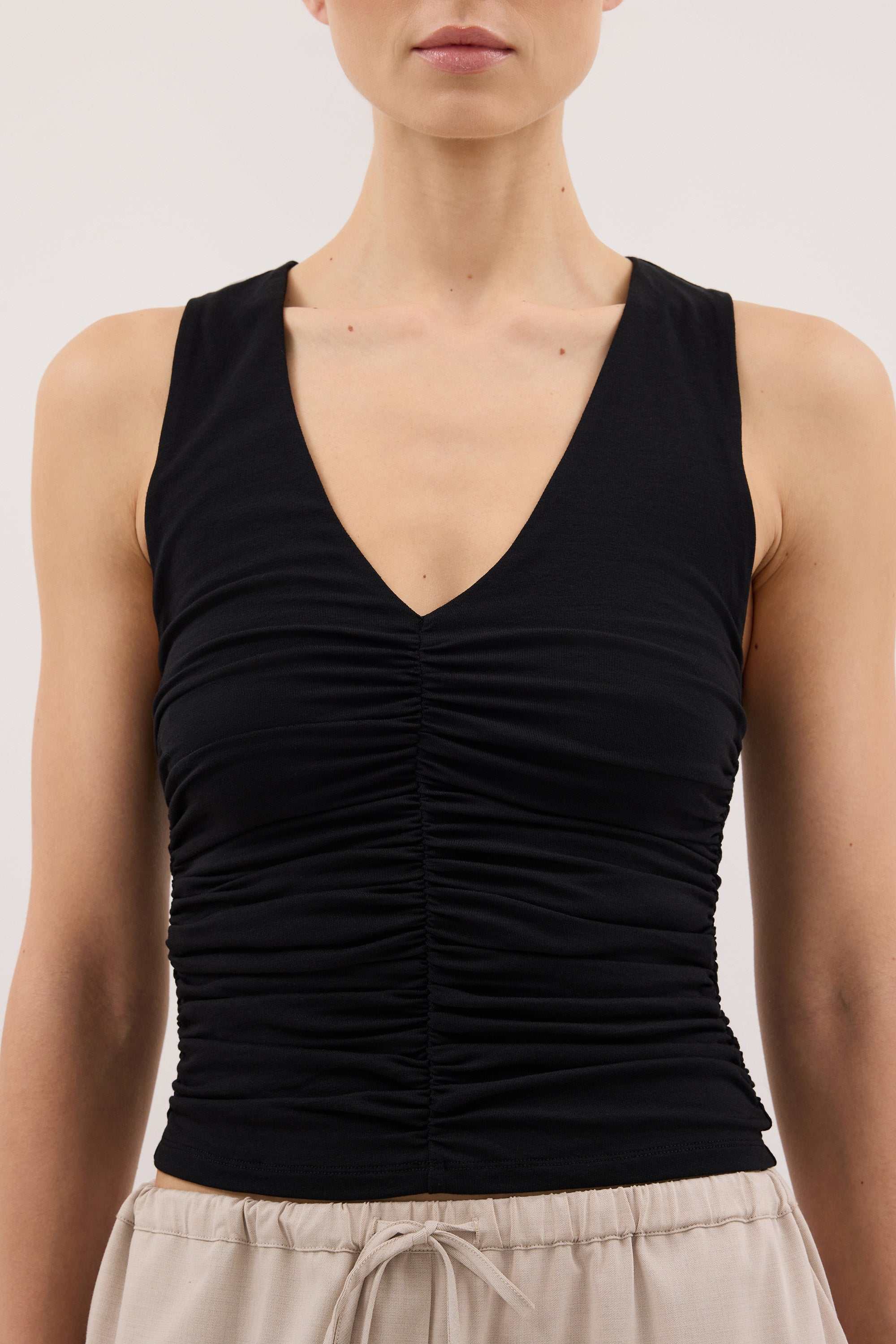 AVELIN BLACK RUCHED V NECK KNIT TOP
