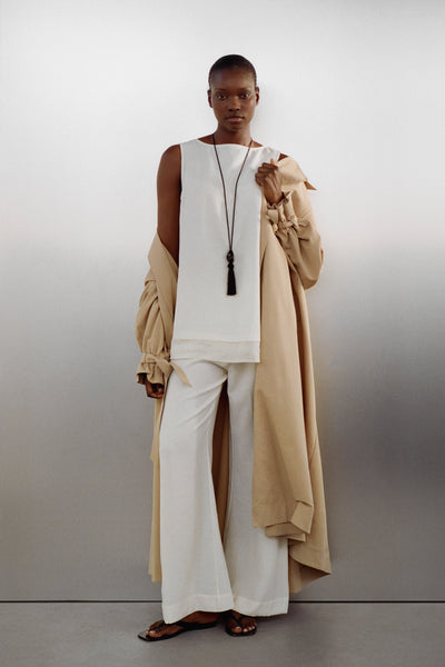 Ayen wearing CALIA CREAM BOAT NECK TUNIC TOP