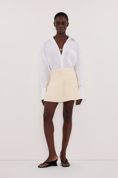 Maguette wearing ALEA STRAW LINEN FLOUNCE MINI SKIRT