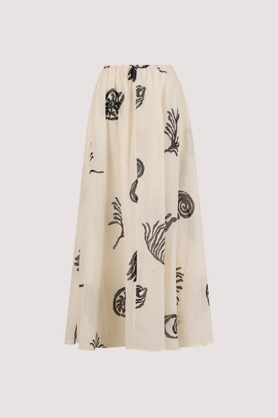 Stas wearing POSITANO SANDSTONE RAMIE MIDI SKIRT