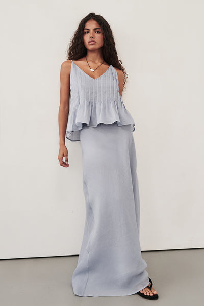 Keilani wearing MAISON DUSTY BLUE RAMIE BIAS MAXI SKIRT