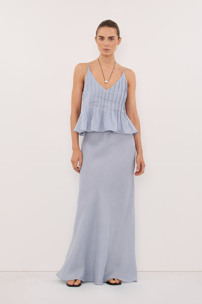 Stas wearing MAISON DUSTY BLUE RAMIE BIAS MAXI SKIRT