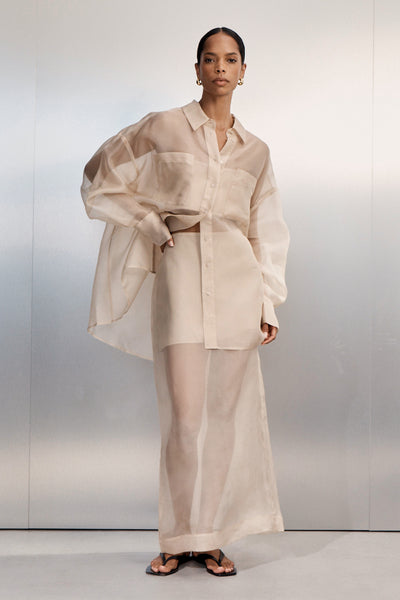 Kristen wearing SIAN GOLD SILK ORGANZA MIDI SKIRT