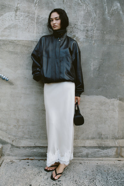 Shanina wearing SELENE OYSTER SATIN MIDI SKIRT
