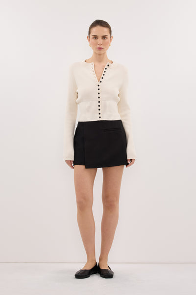 Stas wearing DANICA BLACK ASYM WRAP SKORT