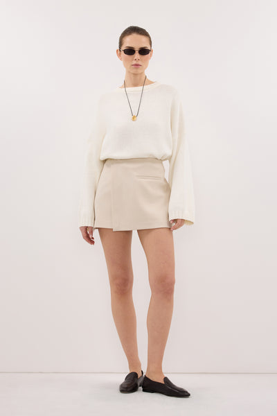 Stas wearing DANICA BONE ASYM WRAP SKORT
