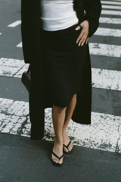 Shanina wearing PARKER BLACK KNEE LENGTH SKIRT