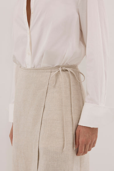 Aude wearing ODETTE NATURAL LINEN WRAP MIDI SKIRT