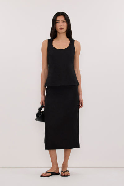 Zoey wearing AURELI BLACK LINEN PENCIL MIDI SKIRT