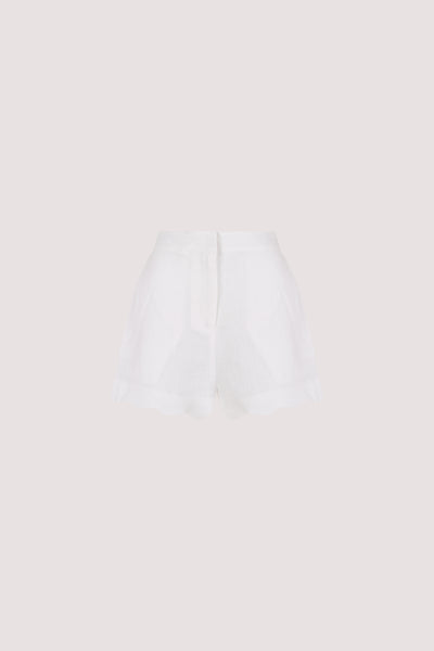 Stas wearing LELA WHITE LINEN SHORT