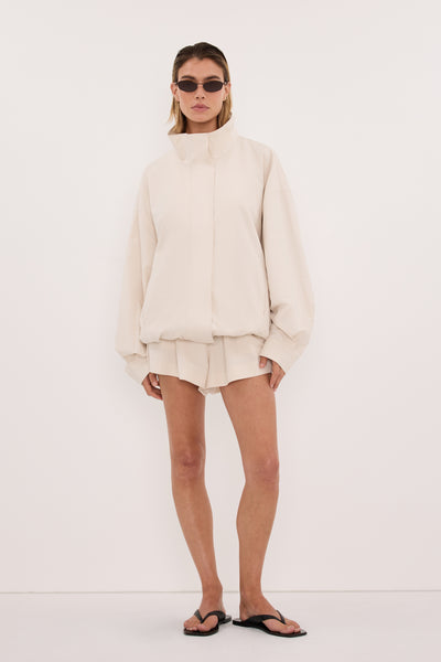 Joanna wearing RORY IVORY LIGHTWEIGHT TRACK SHORT