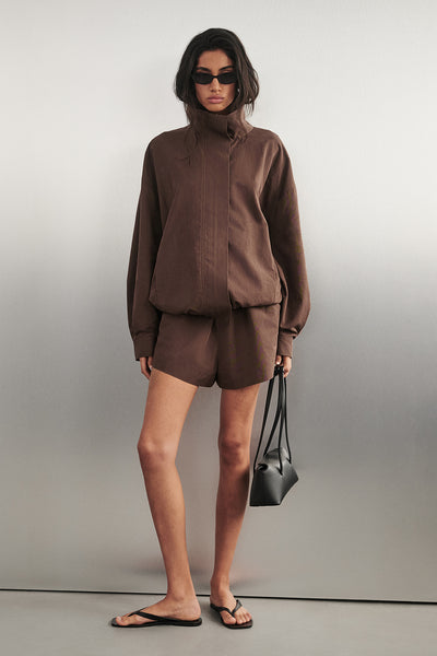 Anaya wearing RORY MILK CHOC LIGHTWEIGHT TRACK SHORT